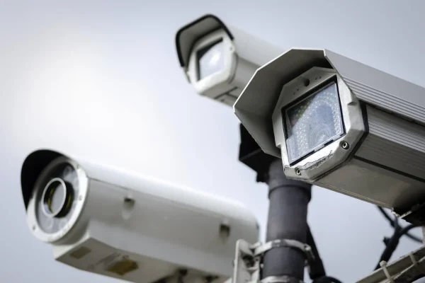 Close Up of a Security CCTV Cameras on a lamp post in the park.